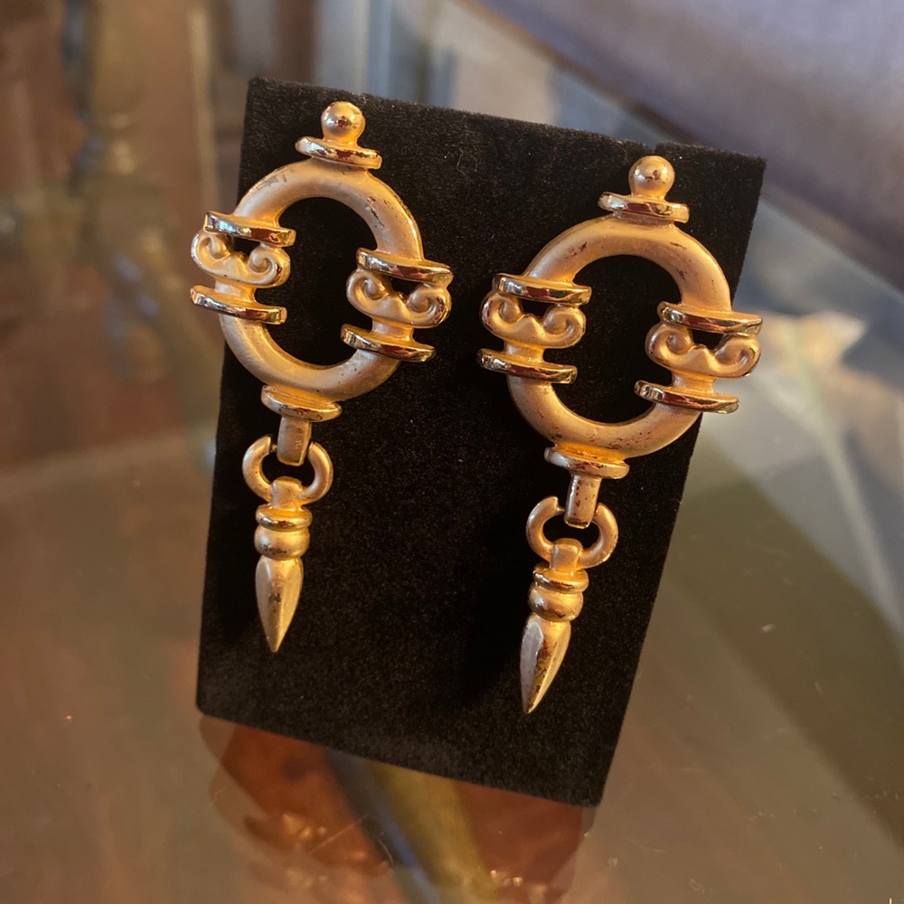 Costume gold colored dangle earrings